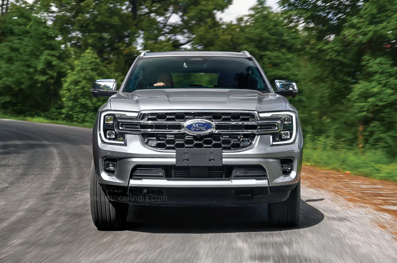 Silver SUV on a scenic road